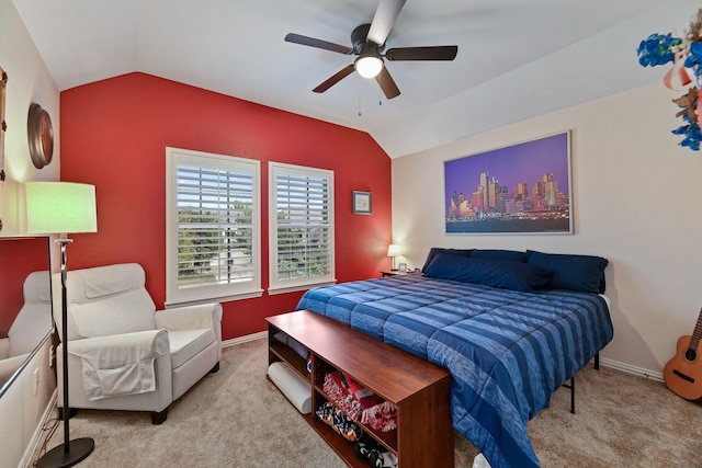 bedroom featuring ceiling fan, light colored carpet, and lofted ceiling