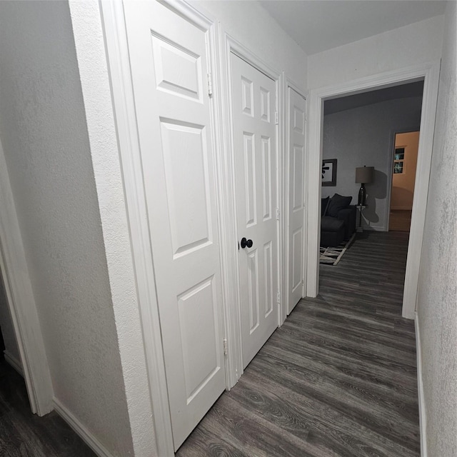 hall featuring dark wood-type flooring