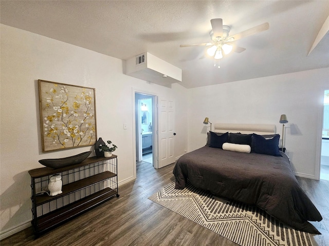 bedroom featuring a textured ceiling, wood-type flooring, and ceiling fan