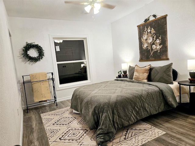 bedroom featuring hardwood / wood-style floors and ceiling fan