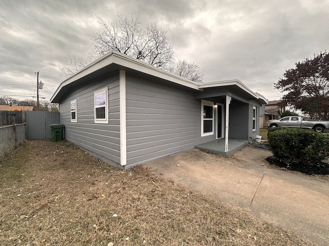 view of side of property with a patio