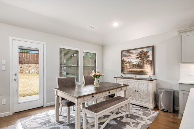 dining space with light hardwood / wood-style floors and a wealth of natural light