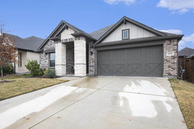 view of front of home featuring a garage and a front lawn