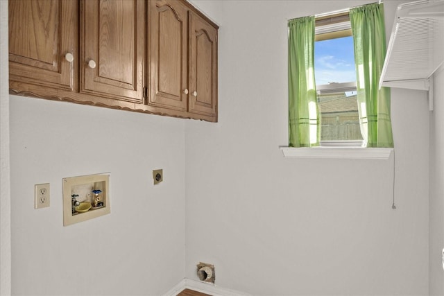 laundry room with hookup for a washing machine, cabinets, and hookup for an electric dryer