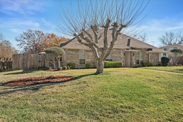 ranch-style house with a front lawn