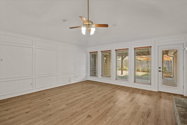 interior space featuring ceiling fan and lofted ceiling