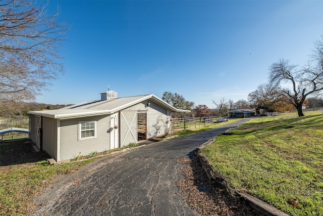 view of side of property featuring a yard