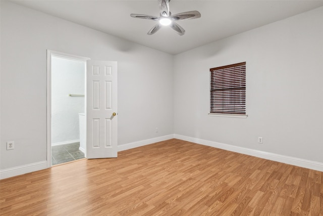 spare room with ceiling fan and light hardwood / wood-style flooring