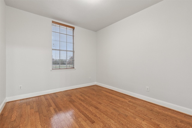 unfurnished room featuring wood-type flooring