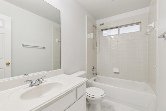 full bathroom featuring washtub / shower combination, vanity, and toilet