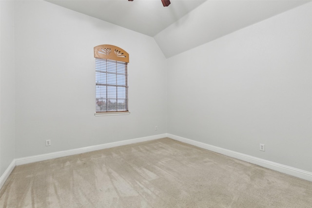 unfurnished room with light carpet, ceiling fan, and lofted ceiling