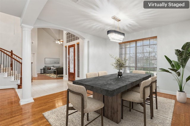 dining room with light hardwood / wood-style flooring and a chandelier