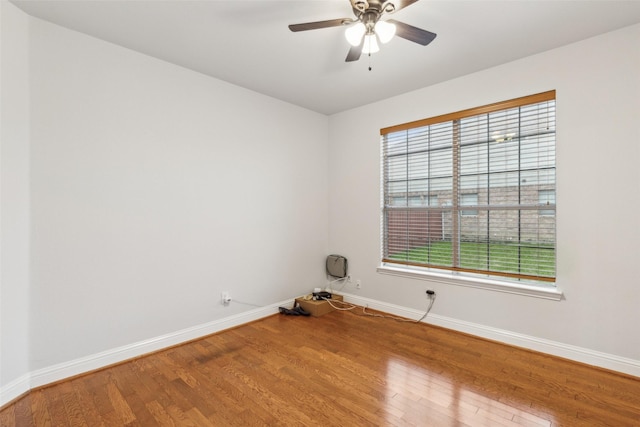 spare room with ceiling fan and hardwood / wood-style floors