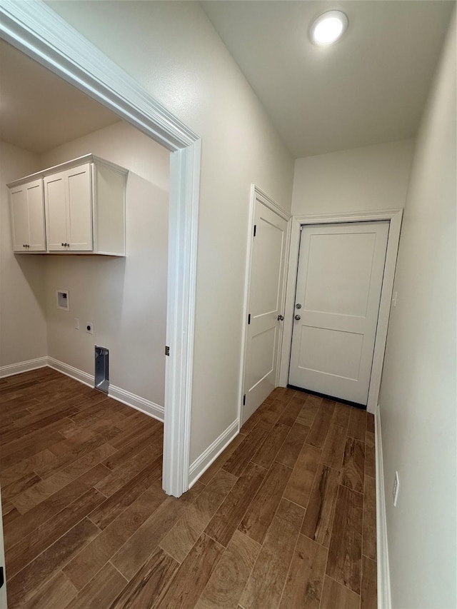 laundry area featuring hookup for a washing machine, electric dryer hookup, dark wood-type flooring, and cabinets