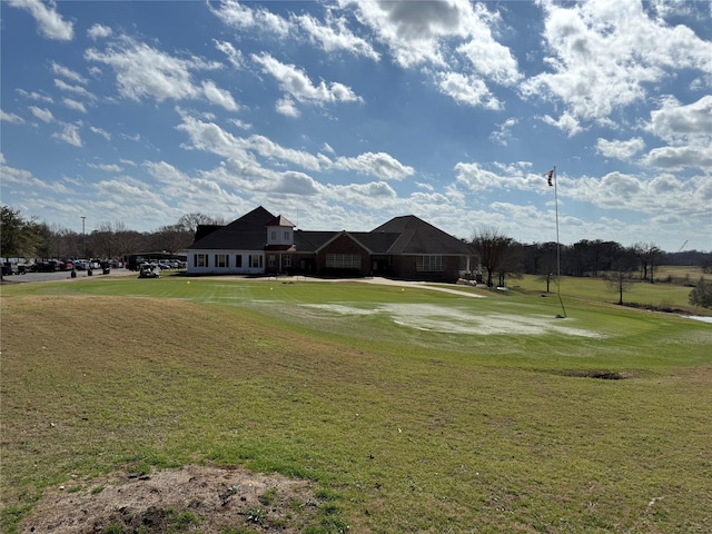 view of home's community featuring a yard