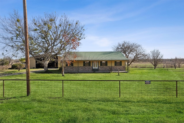 view of front of house featuring a front yard and a rural view