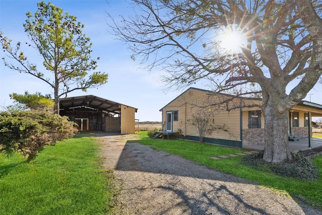 view of side of property featuring a carport