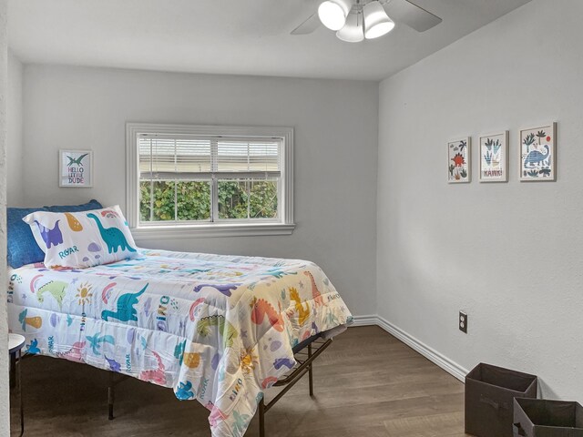 bedroom featuring hardwood / wood-style flooring and ceiling fan