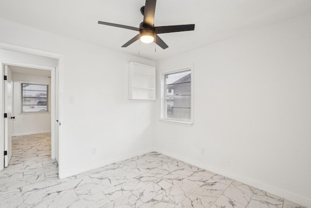 unfurnished room with ceiling fan