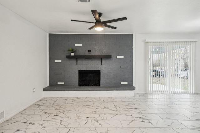 unfurnished living room with ceiling fan and a fireplace