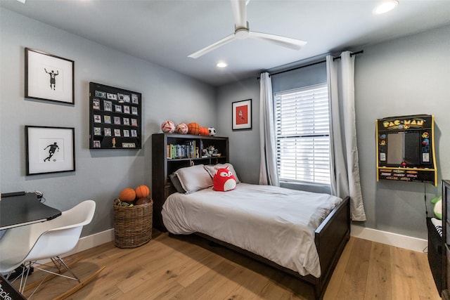 bedroom with ceiling fan and hardwood / wood-style flooring