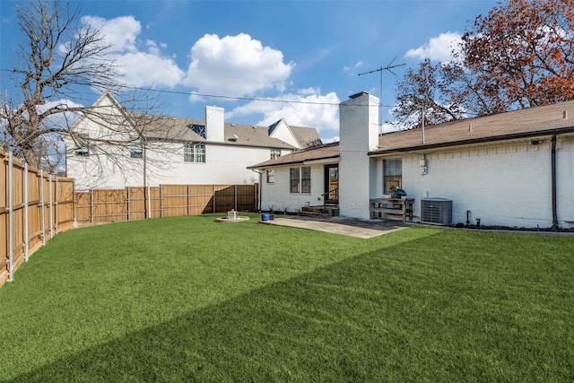 back of house with a yard, a patio, and central AC unit