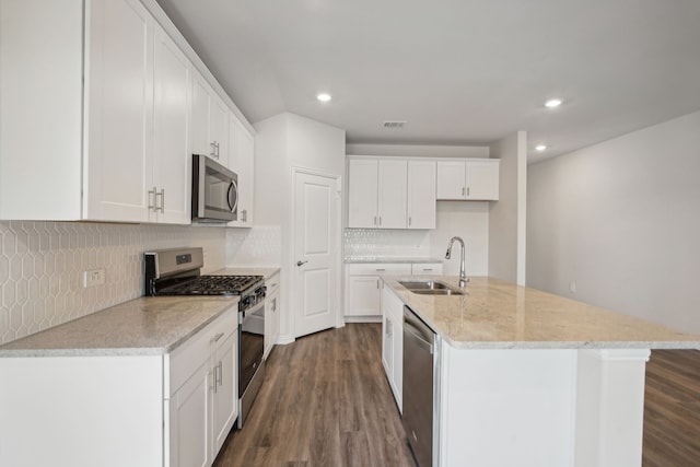 kitchen featuring white cabinetry, sink, and appliances with stainless steel finishes