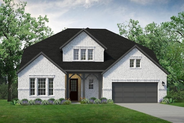 view of front of home with a garage and a front lawn