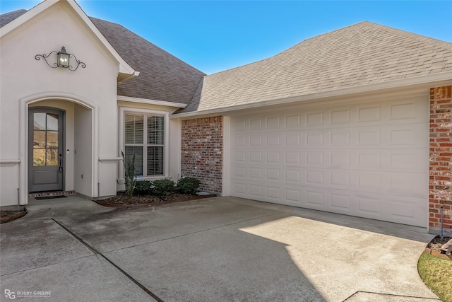 view of front of property with a garage