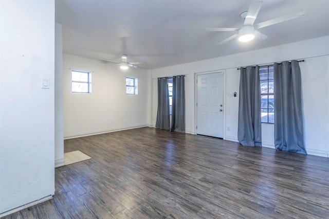 spare room with ceiling fan and dark wood-type flooring