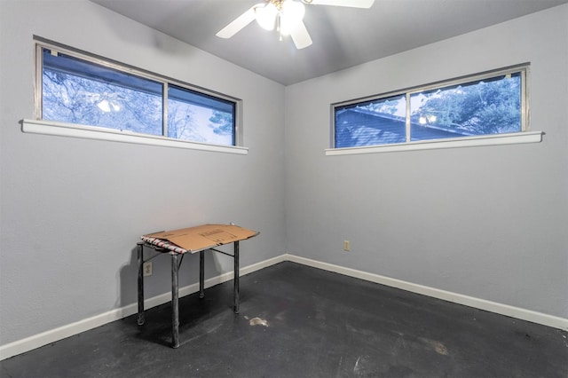 interior space with ceiling fan