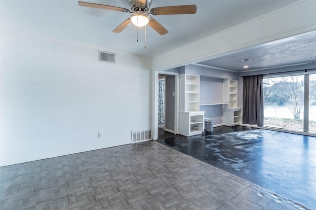 unfurnished room with dark parquet flooring and ceiling fan