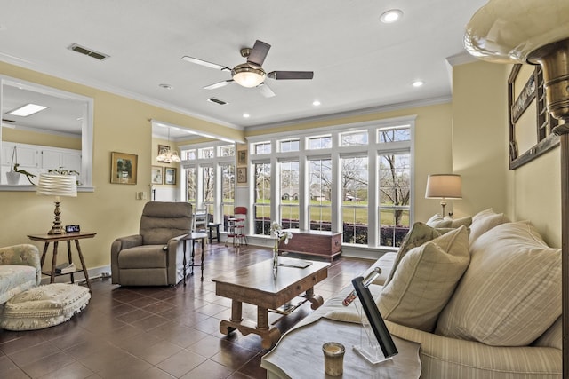 tiled living room with ornamental molding and ceiling fan