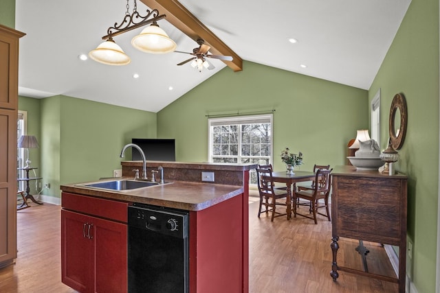 kitchen with a center island with sink, lofted ceiling with beams, sink, ceiling fan, and black dishwasher