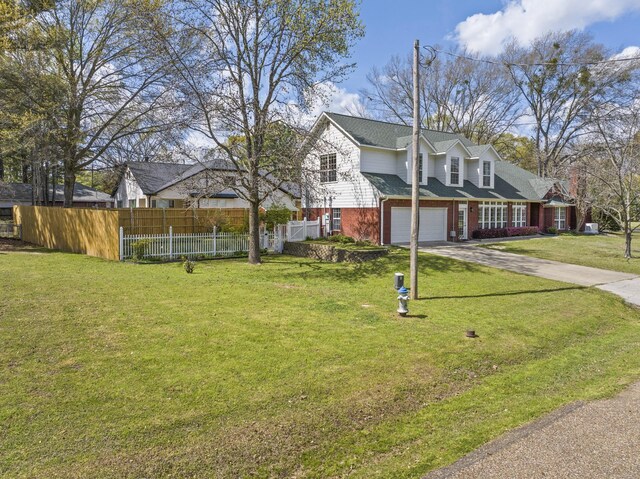 exterior space with a garage and a yard