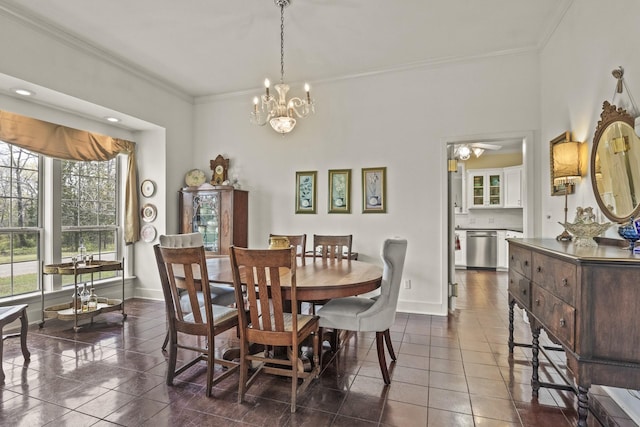 tiled dining area with crown molding and a chandelier