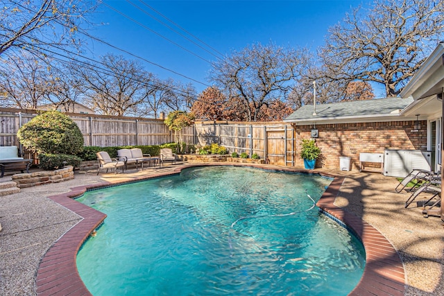 view of swimming pool with a patio, a fenced backyard, and a fenced in pool