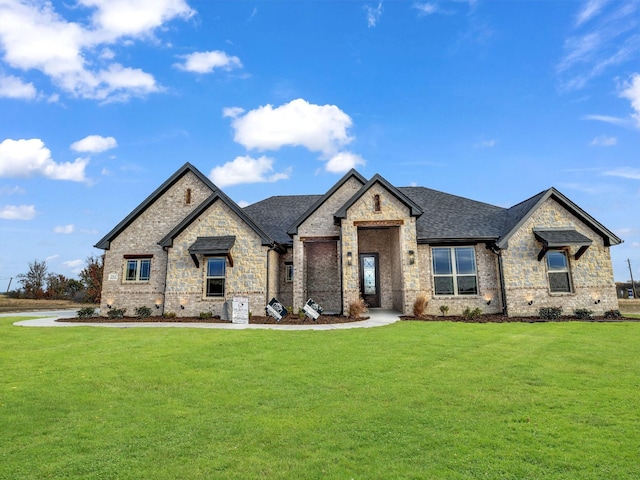 french provincial home with a front lawn