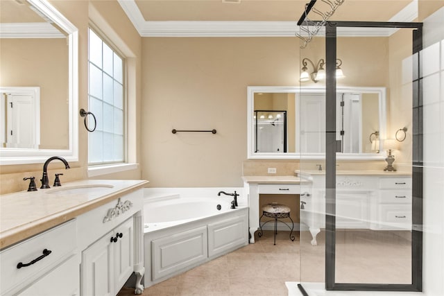 bathroom featuring tile patterned flooring, vanity, crown molding, and a tub