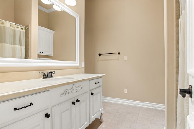 bathroom with tile patterned flooring and vanity