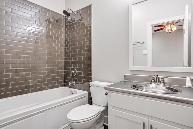 full bathroom with  shower combination, vanity, toilet, and a ceiling fan