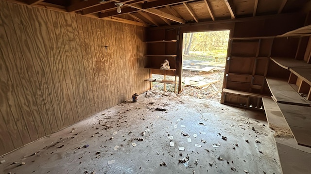 miscellaneous room with wooden walls