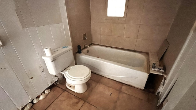 bathroom featuring toilet and tile patterned flooring