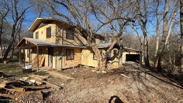 view of front of house with a carport and a garage