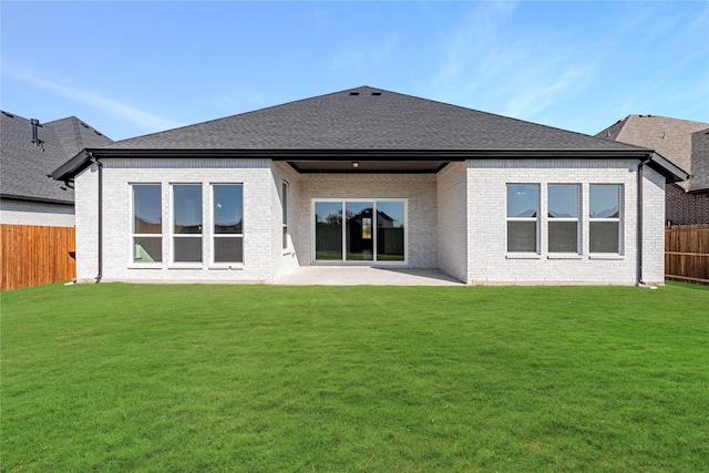 back of property featuring a yard and a patio area