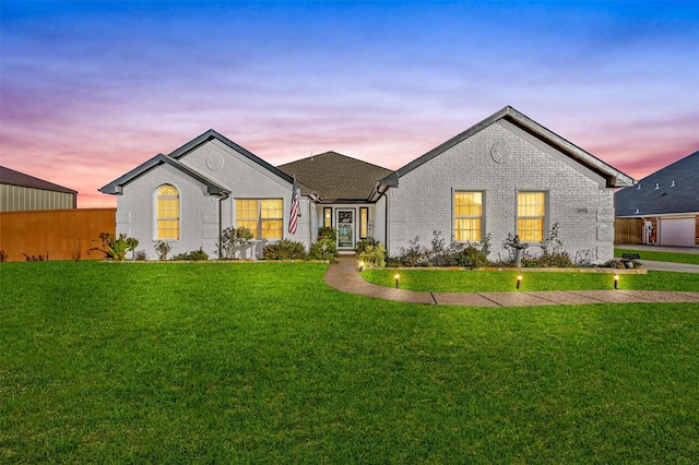 view of front of house with a yard