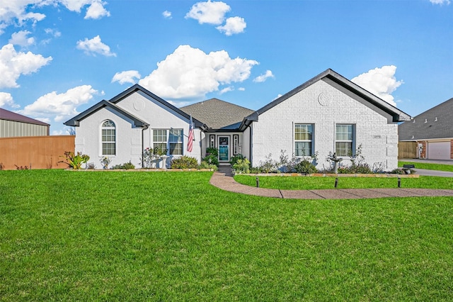 ranch-style home featuring a front yard