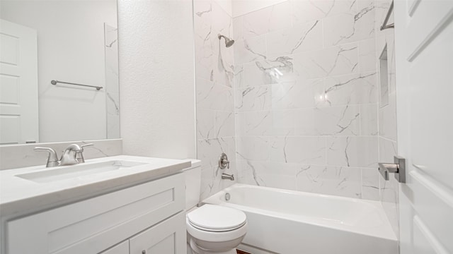 full bathroom featuring vanity, toilet, and tiled shower / bath