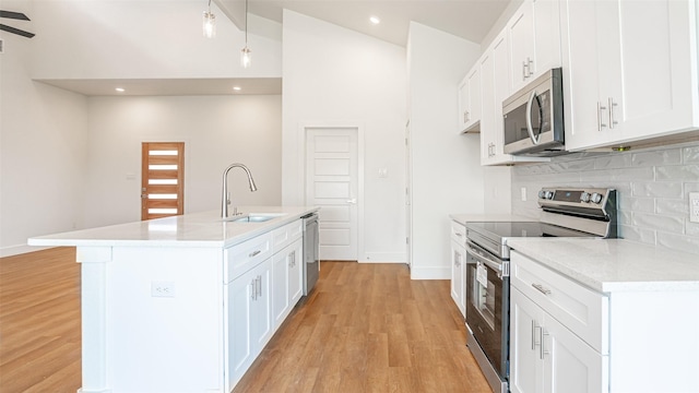 kitchen featuring sink, white cabinets, and stainless steel appliances