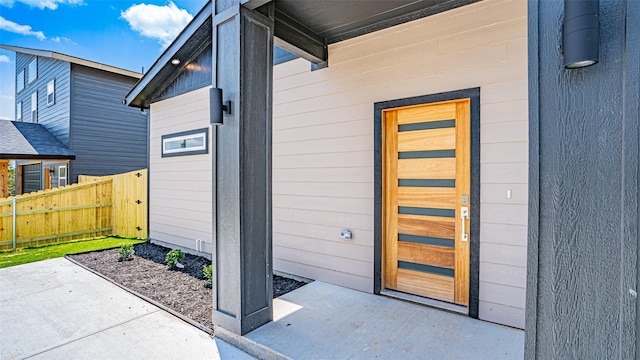 doorway to property with a patio area